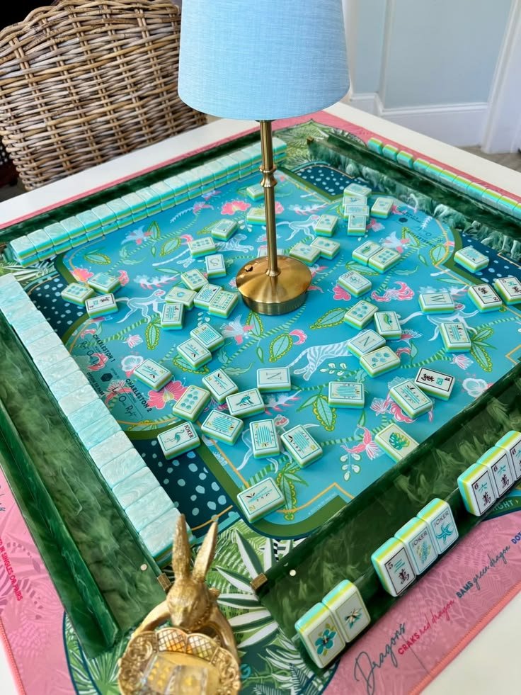 A blue and green floral mahjong board mid-game